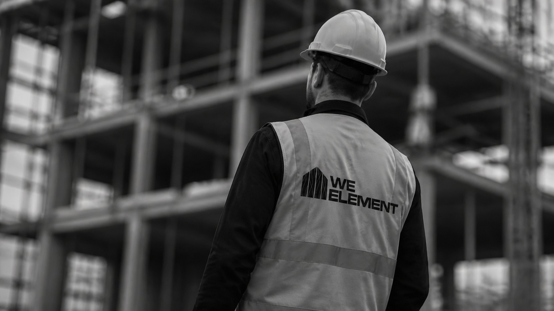WE Element worker assembling a timber frame structure on site
